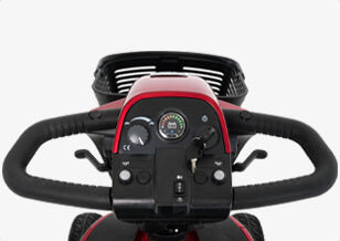 Close-up of a steering wheel with control buttons on a vehicle, likely a golf cart or similar vehicle.